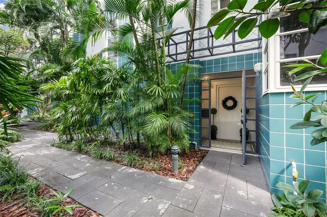 a house with a tree in front of it