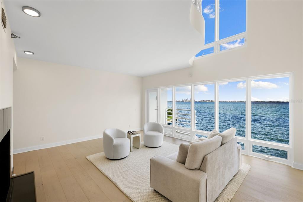 4950 Bayshore Boulevard, Unit 23 Tampa, FL 33611 - Photo 6 of 40 a living room with furniture and a floor to ceiling window