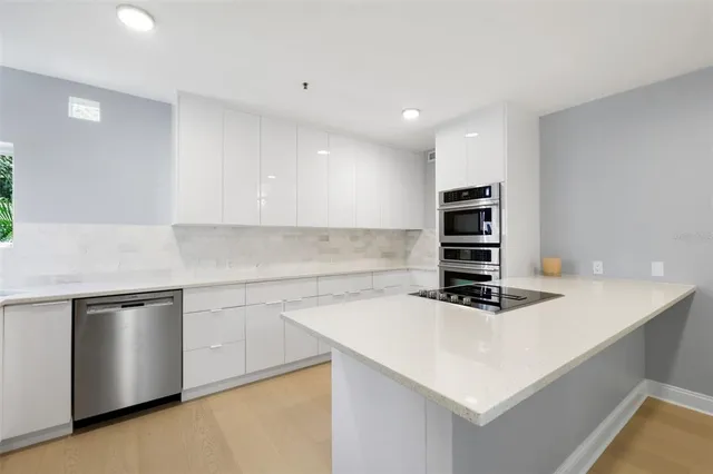 a kitchen with a white appliances