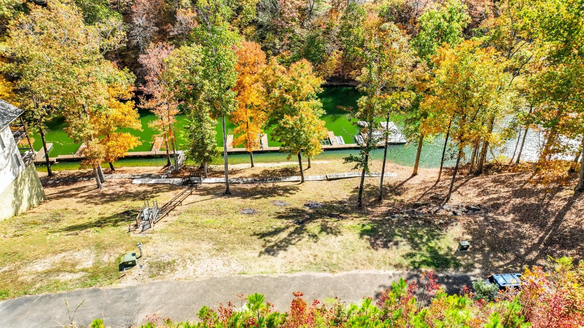 12 Breeze Point Savannah, TN 38372 - Photo 9 of 15 a view of yard with swimming pool and trees