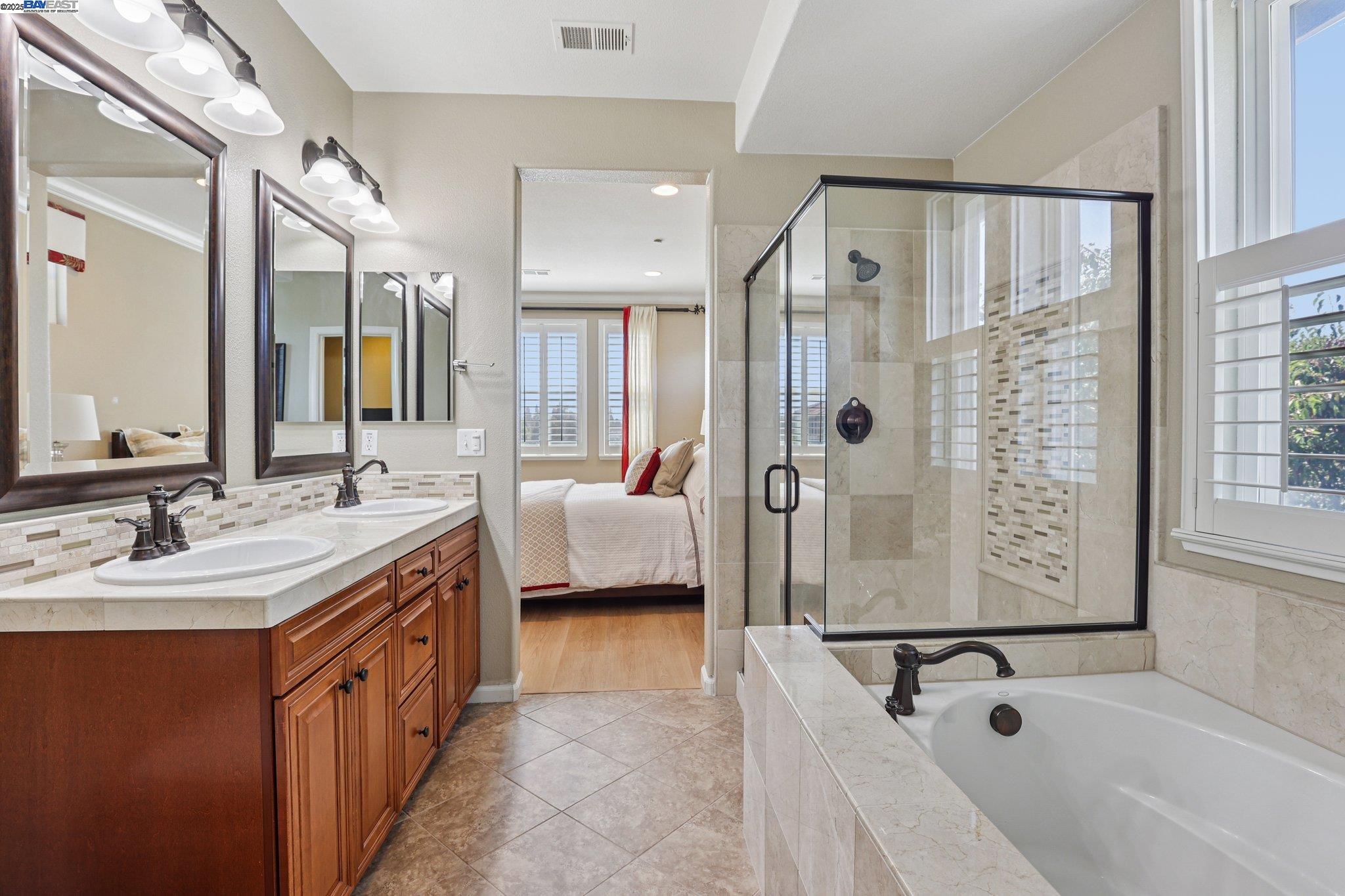 622 Moss Way Hayward, CA 94541 - Photo 23 of 25 a spacious bathroom with a tub shower and sink