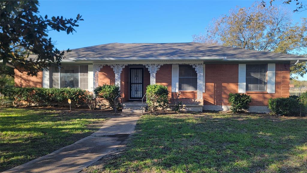 2001 East Alma Avenue Sherman, TX 75090 - Photo 1 of 16 a view of a house with a yard and plants