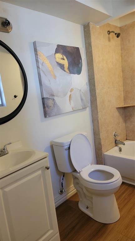 2001 East Alma Avenue Sherman, TX 75090 - Photo 13 of 16 a white toilet sitting next to a bathroom sink