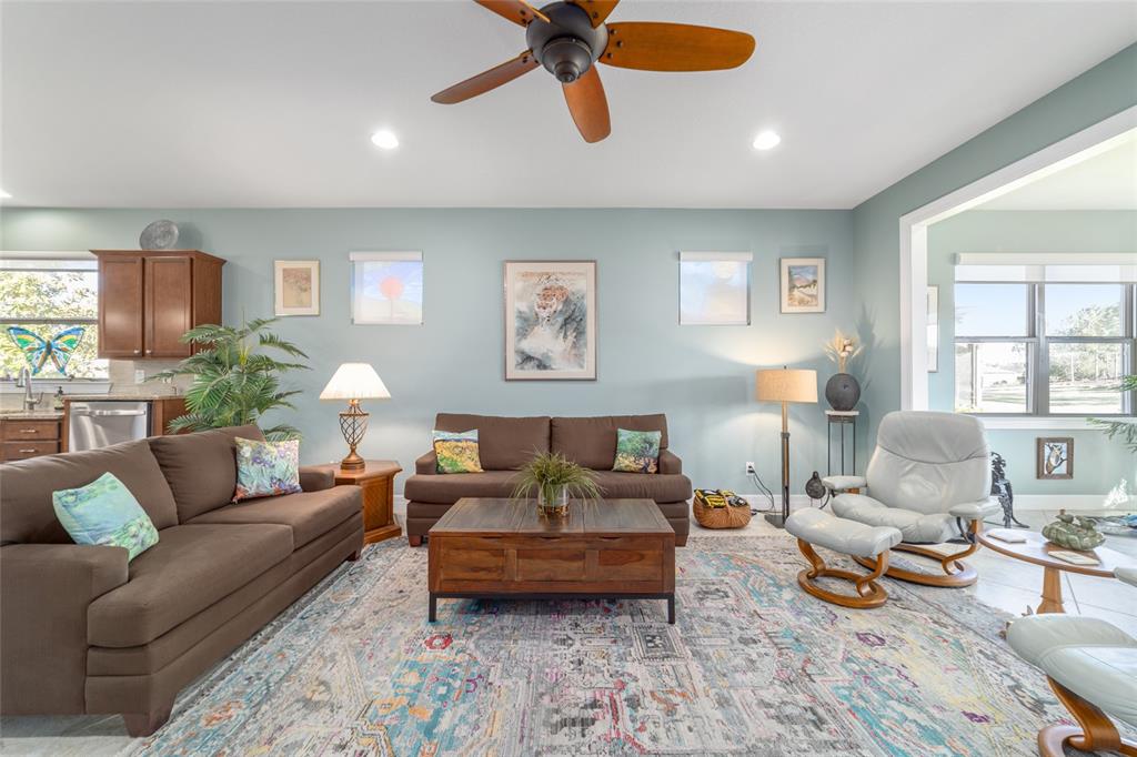 10106 Southwest 77th Loop Ocala, FL 34481 - Photo 11 of 69 a living room with furniture and a large window
