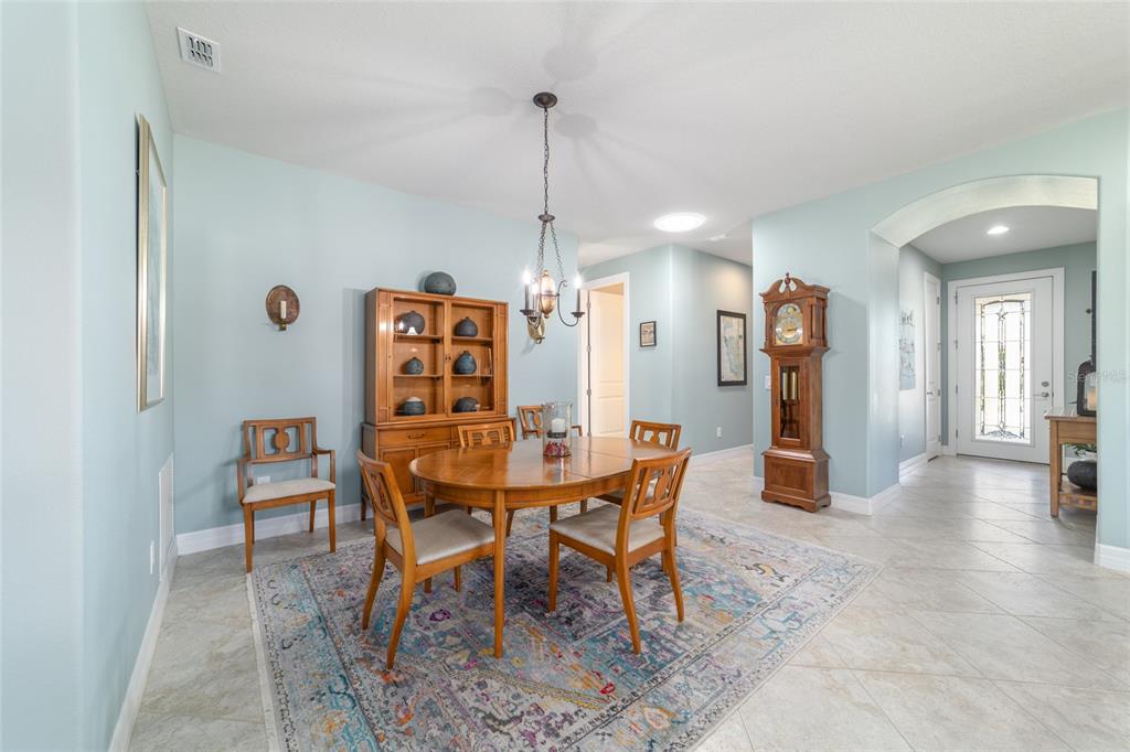 10106 Southwest 77th Loop Ocala, FL 34481 - Photo 22 of 69 a view of a dining room with furniture