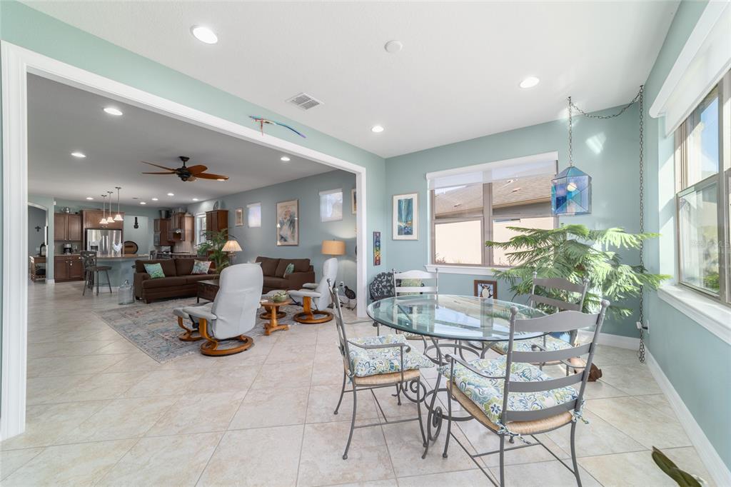 10106 Southwest 77th Loop Ocala, FL 34481 - Photo 26 of 69 a dining room with a table and chairs