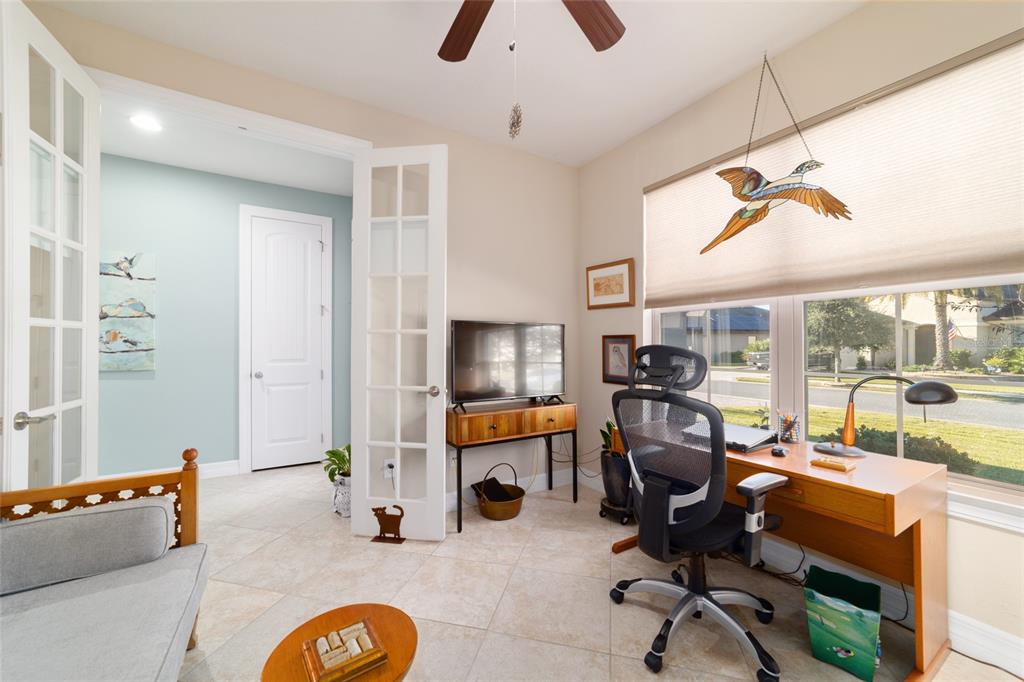 10106 Southwest 77th Loop Ocala, FL 34481 - Photo 41 of 69 a view of a livingroom with workspace and a window