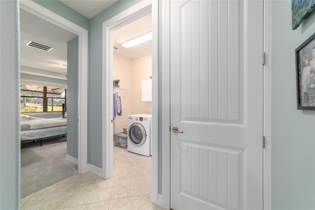 10106 Southwest 77th Loop Ocala, FL 34481 - Photo 42 of 69 a view of a hallway with bathroom and glass door