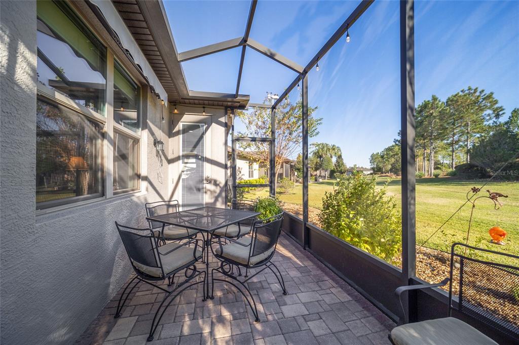 10106 Southwest 77th Loop Ocala, FL 34481 - Photo 47 of 69 a view of a chairs and table in the balcony