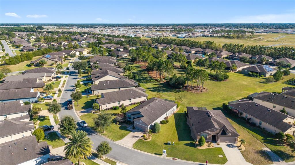 10106 Southwest 77th Loop Ocala, FL 34481 - Photo 52 of 69 an aerial view of residential houses with outdoor space and swimming pool