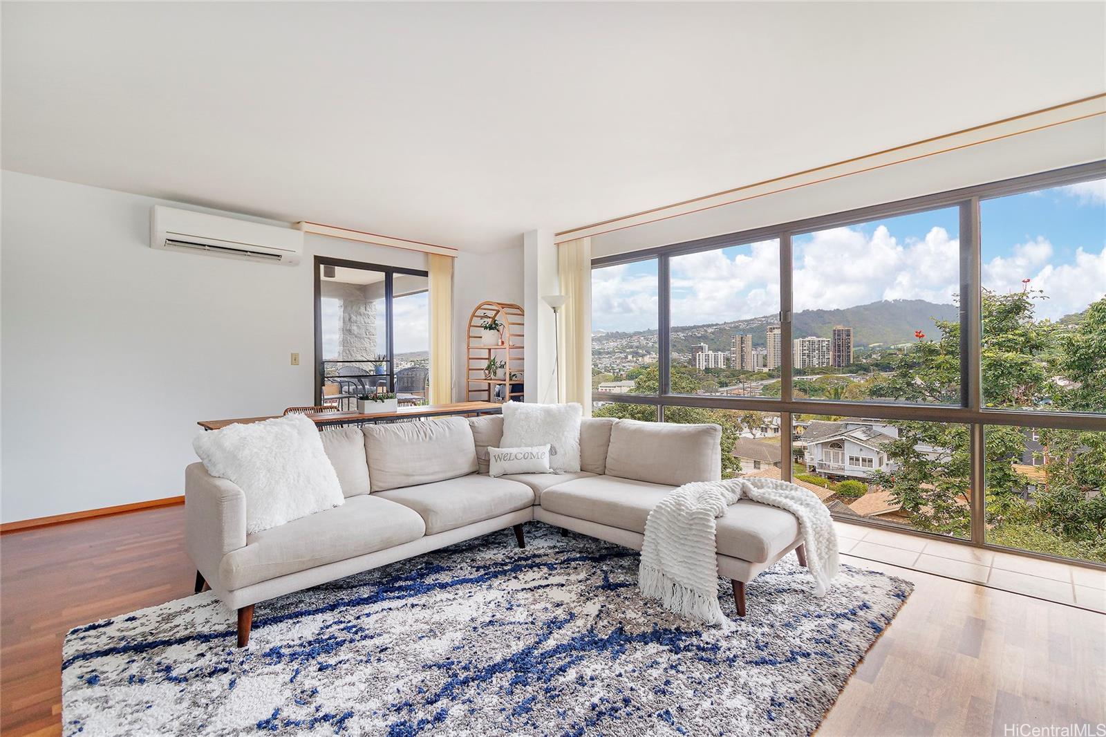 a living room with furniture and a large window