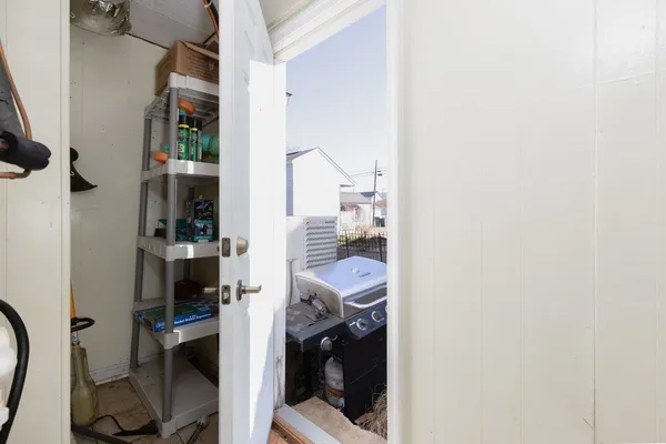 a kitchen with a stove a sink and a refrigerator