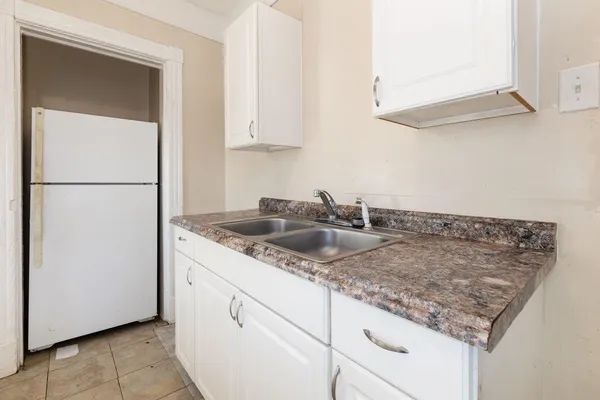a utility room with cabinets