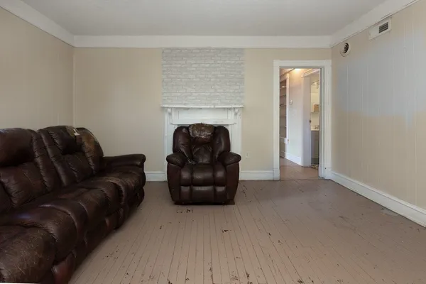 a bedroom with a bed and couch