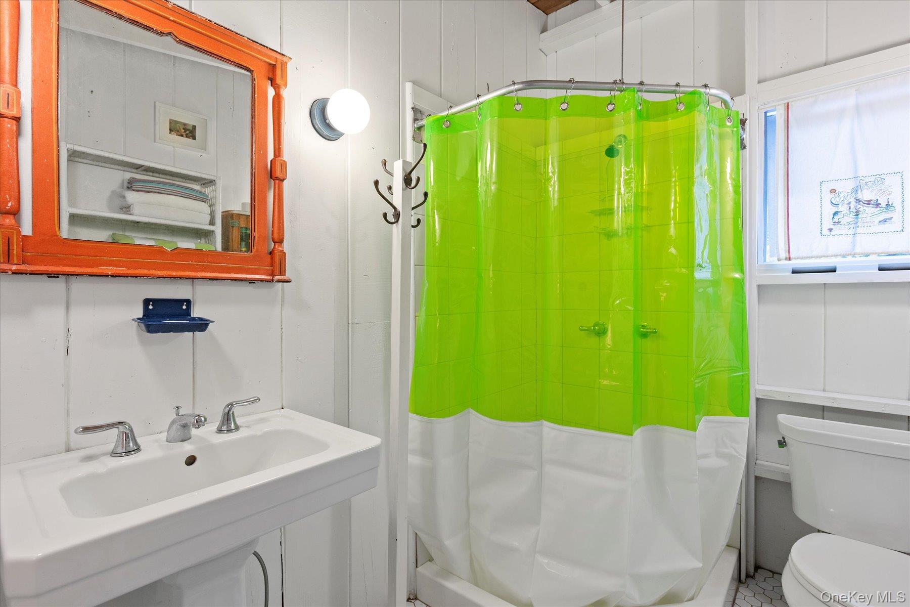 46 Flaggy Hole Road East Hampton, NY 11937 - Photo 19 of 32 a bathroom with a sink and a mirror