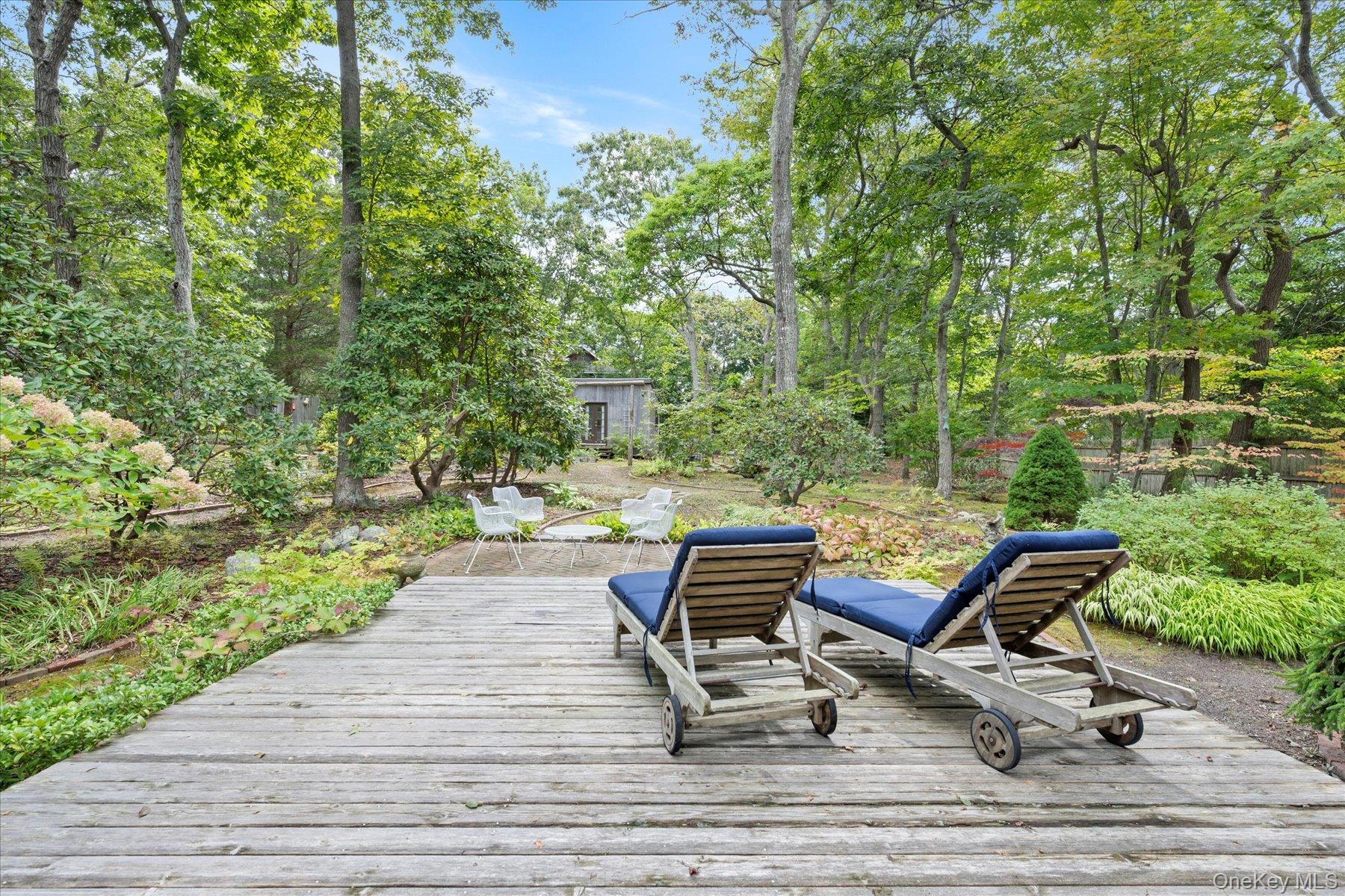 46 Flaggy Hole Road East Hampton, NY 11937 - Photo 29 of 32 a view of a lounge chair on the terrace