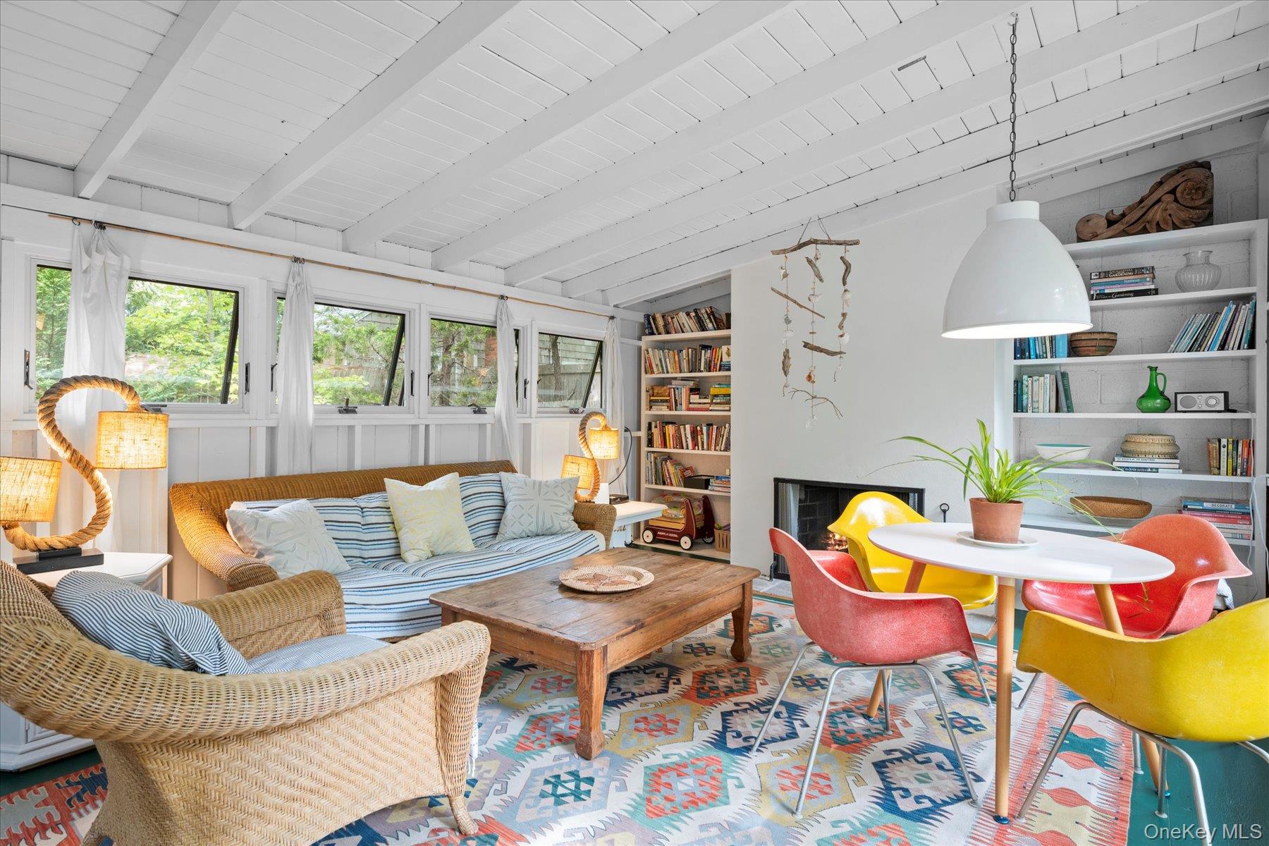 46 Flaggy Hole Road East Hampton, NY 11937 - Photo 9 of 32 a living room with fireplace furniture and a large window