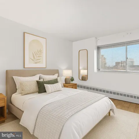 a bedroom with bed and window