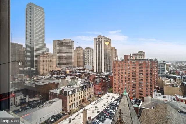 a view of city with tall buildings