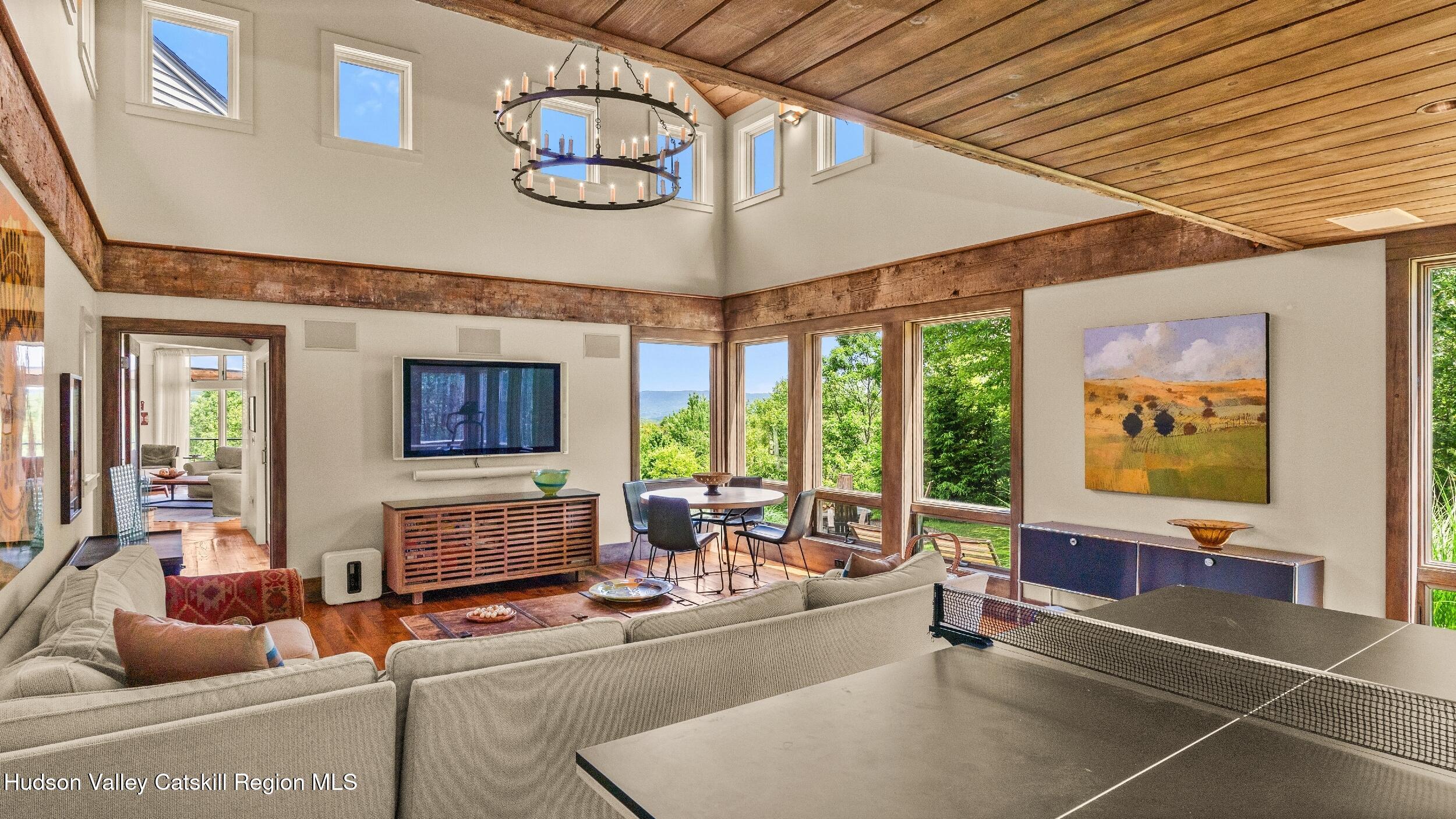 74 Oak Ridge Canaan, NY 12029 - Photo 19 of 54 a living room with furniture a flat screen tv and a large window