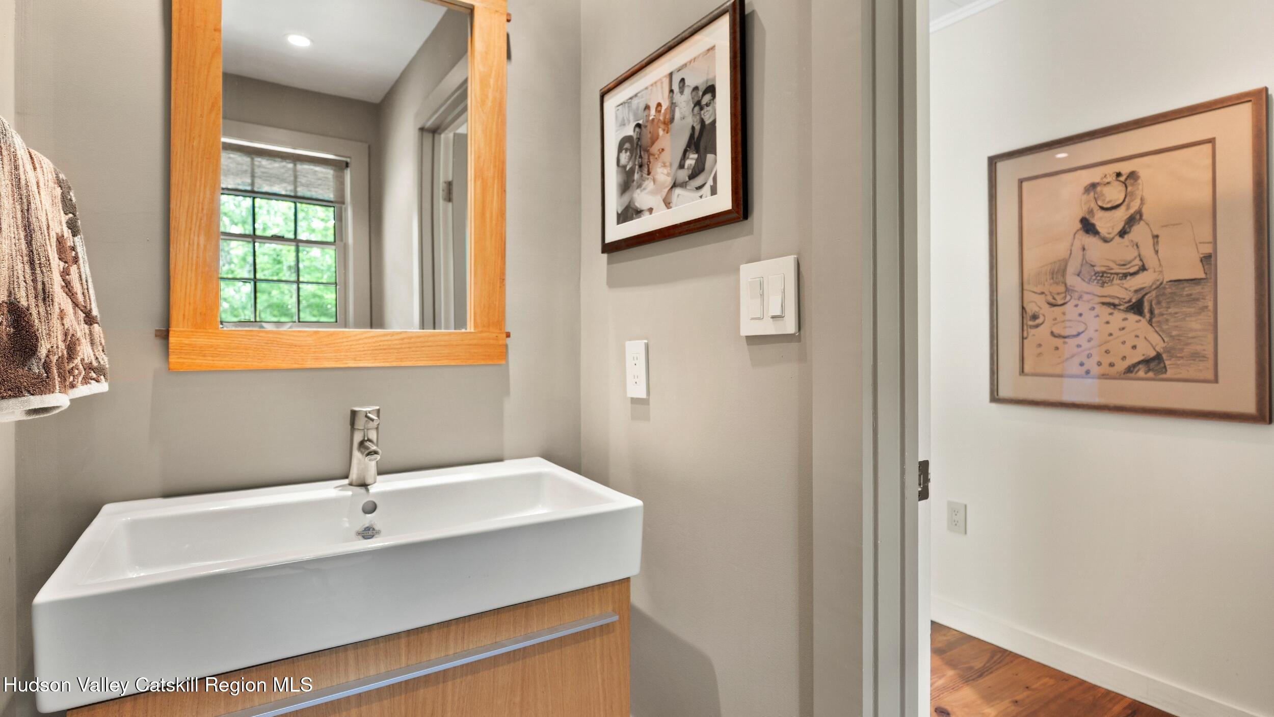 74 Oak Ridge Canaan, NY 12029 - Photo 23 of 54 a bathroom with a sink and a window