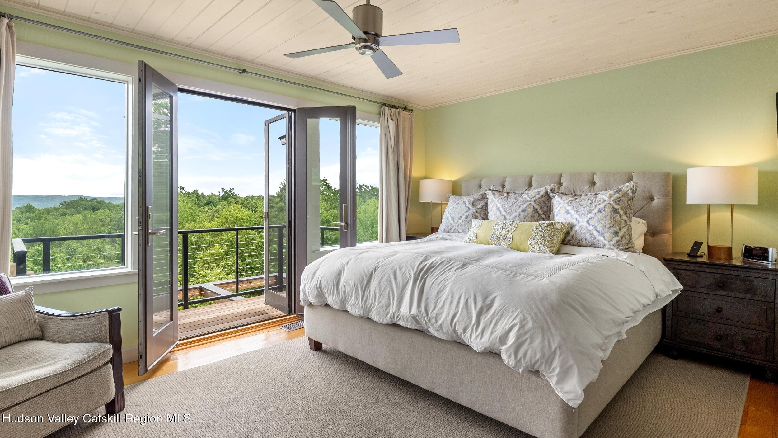 74 Oak Ridge Canaan, NY 12029 - Photo 24 of 54 a spacious bedroom with a bed and glass walk in closet