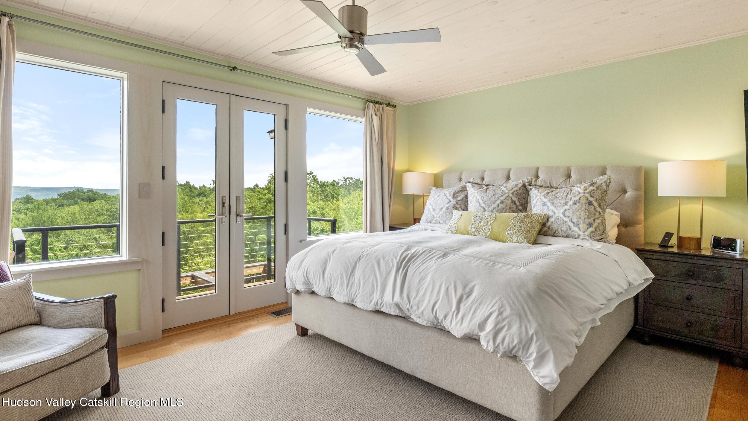 74 Oak Ridge Canaan, NY 12029 - Photo 25 of 54 a spacious bedroom with a bed and glass walk in closet
