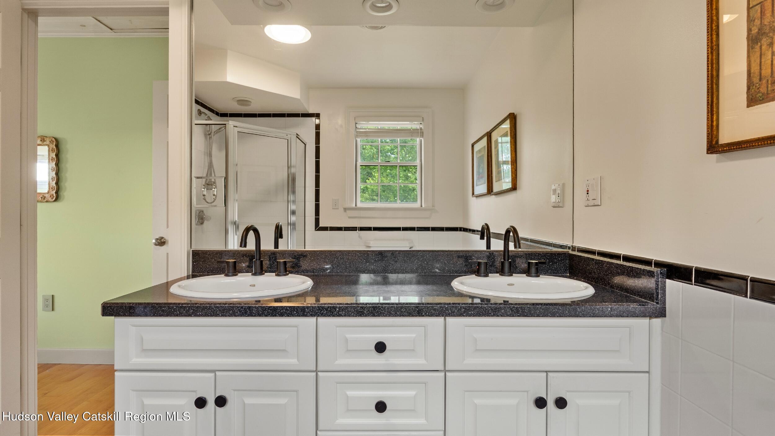 74 Oak Ridge Canaan, NY 12029 - Photo 27 of 54 a bathroom with double sink and a mirror