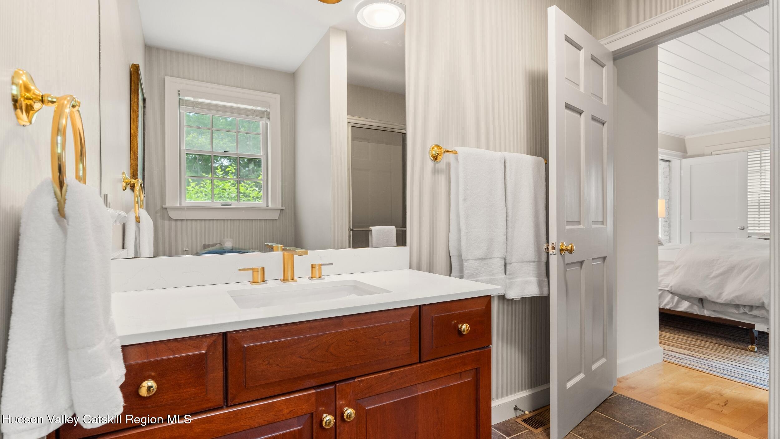 74 Oak Ridge Canaan, NY 12029 - Photo 29 of 54 a en suite bathroom with a sink a mirror and a shower