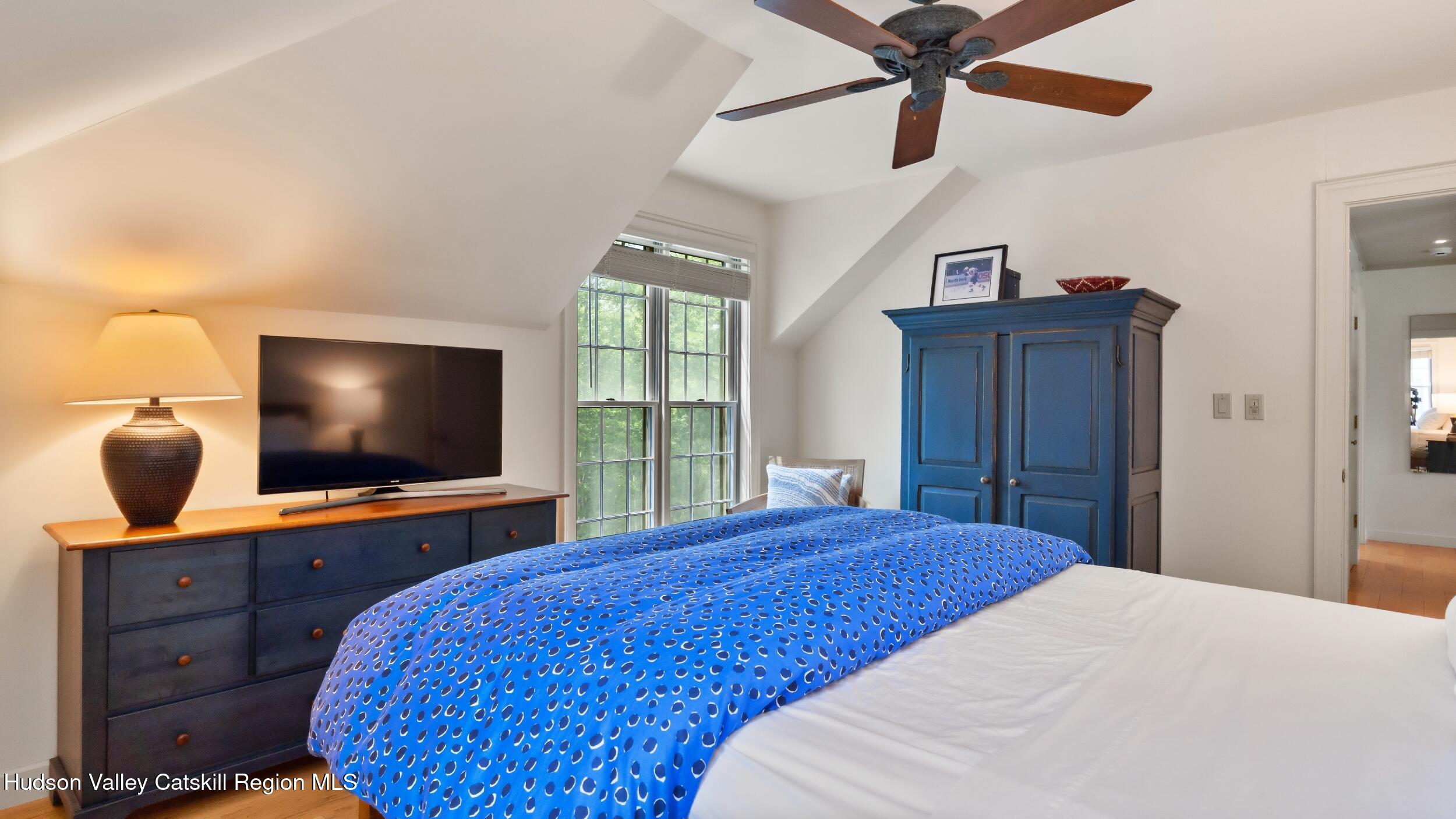 74 Oak Ridge Canaan, NY 12029 - Photo 31 of 54 a bedroom with a bed and a flat screen tv