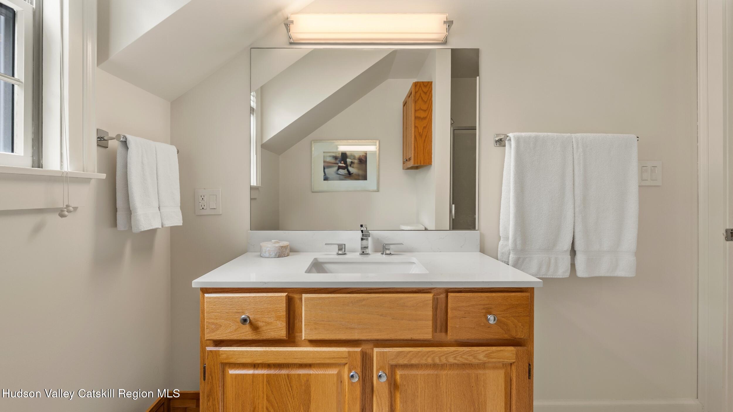74 Oak Ridge Canaan, NY 12029 - Photo 34 of 54 a bathroom with a sink and a mirror