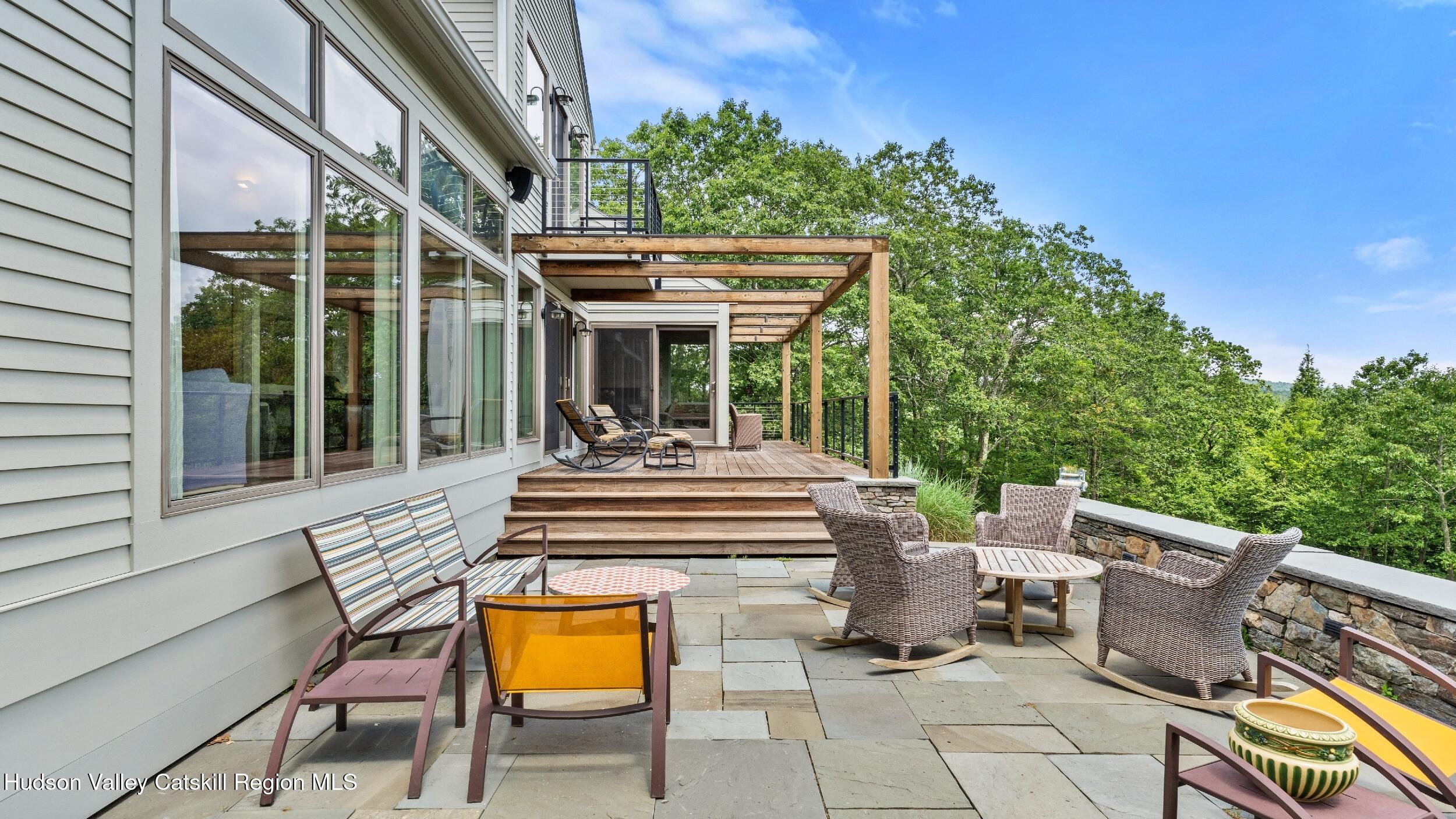 74 Oak Ridge Canaan, NY 12029 - Photo 36 of 54 a view of a patio with table and chairs and potted plants