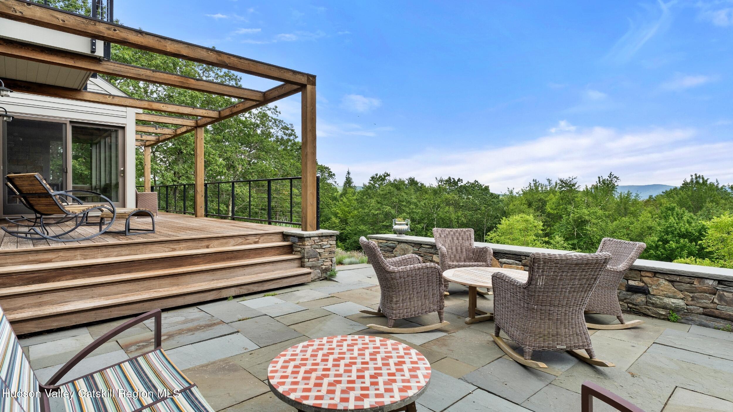 74 Oak Ridge Canaan, NY 12029 - Photo 37 of 54 a view of a patio with couches chairs and a table and chairs