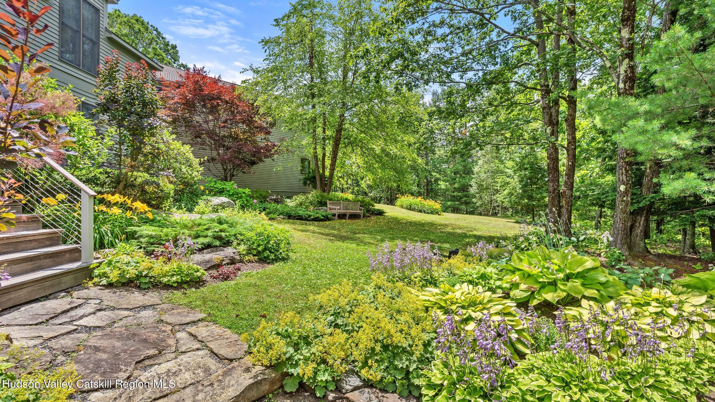 74 Oak Ridge Canaan, NY 12029 - Photo 44 of 54 a view of a garden with a bench