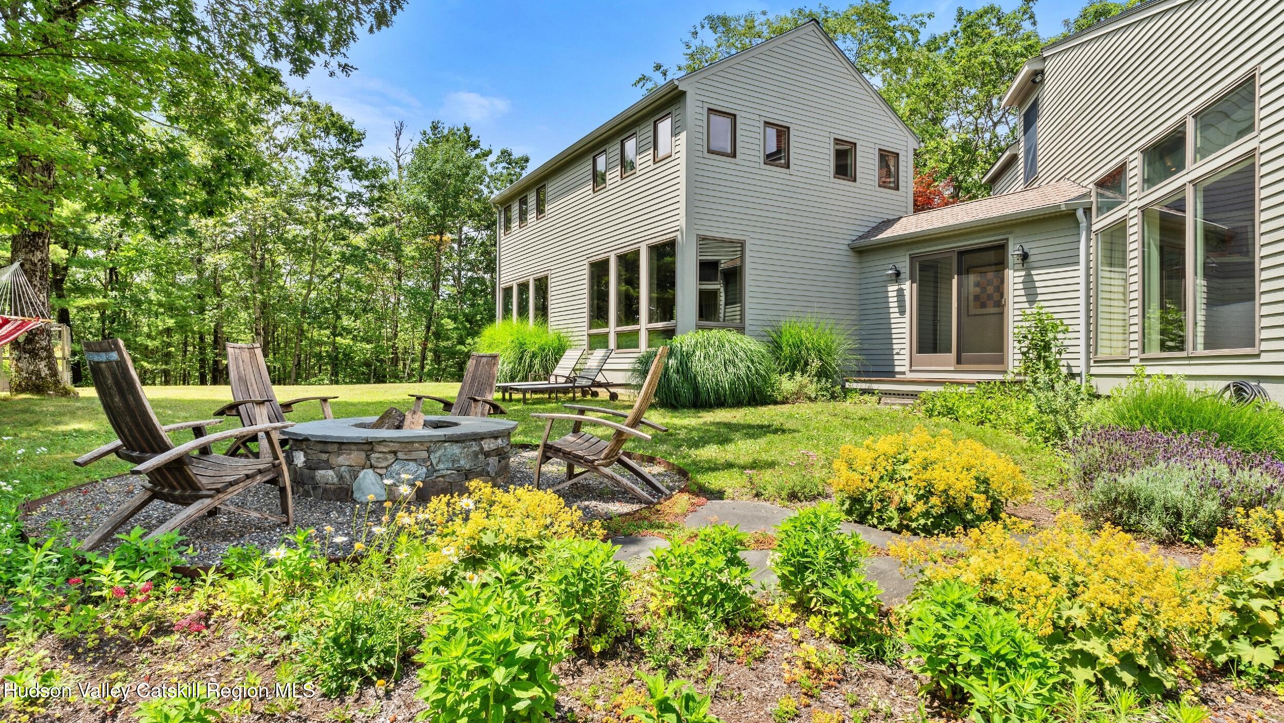 74 Oak Ridge Canaan, NY 12029 - Photo 48 of 54 a view of a house with backyard sitting area and garden