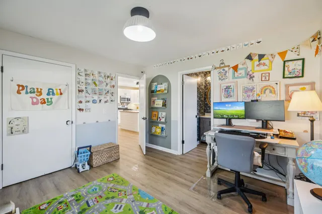 a workspace with furniture and wooden floor