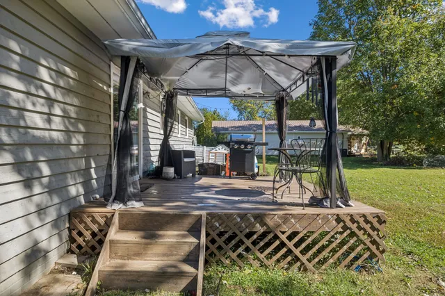 a view of a chairs and table in the patio