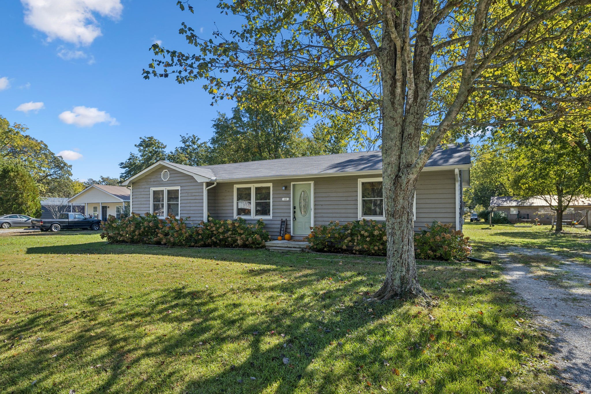 440 West Maple Street Morrison, TN 37357 - Photo 4 of 24 a front view of a house with garden