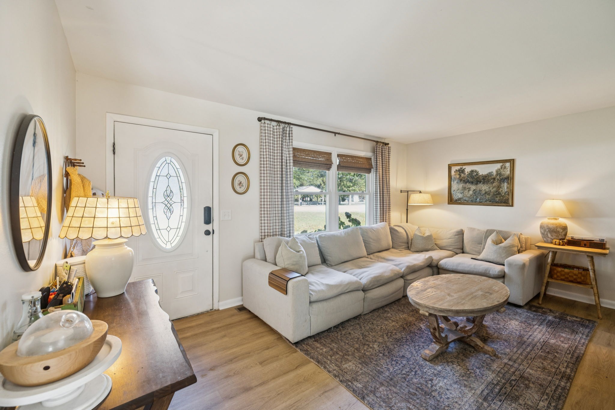 440 West Maple Street Morrison, TN 37357 - Photo 7 of 24 a living room with furniture a rug a lamp paintings and a window