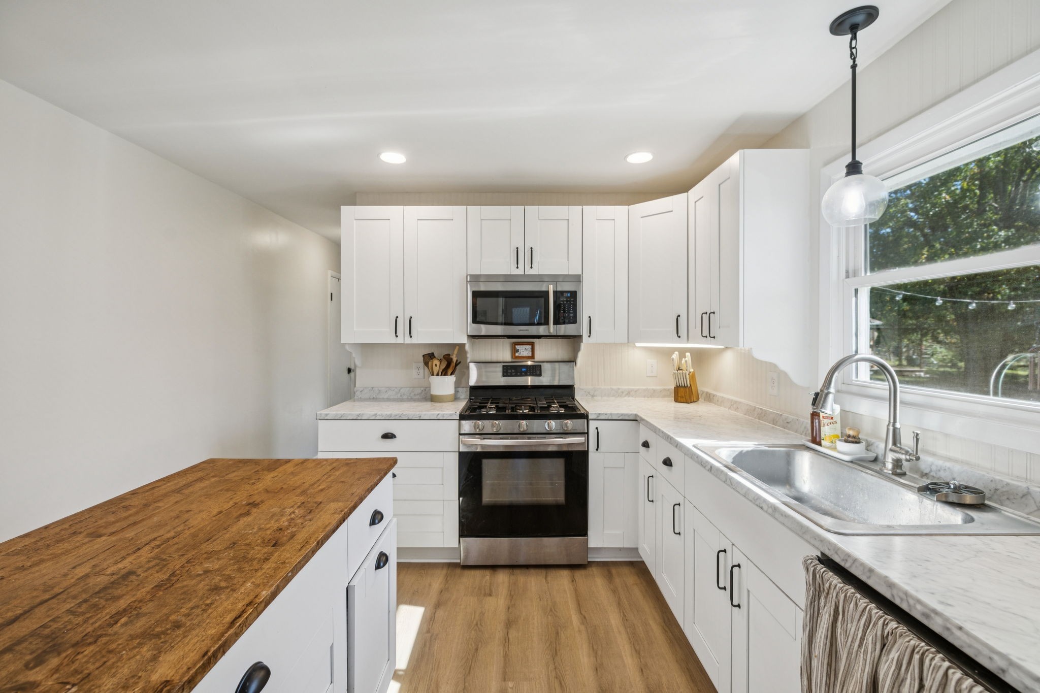 440 West Maple Street Morrison, TN 37357 - Photo 9 of 24 a kitchen with a sink stove and microwave