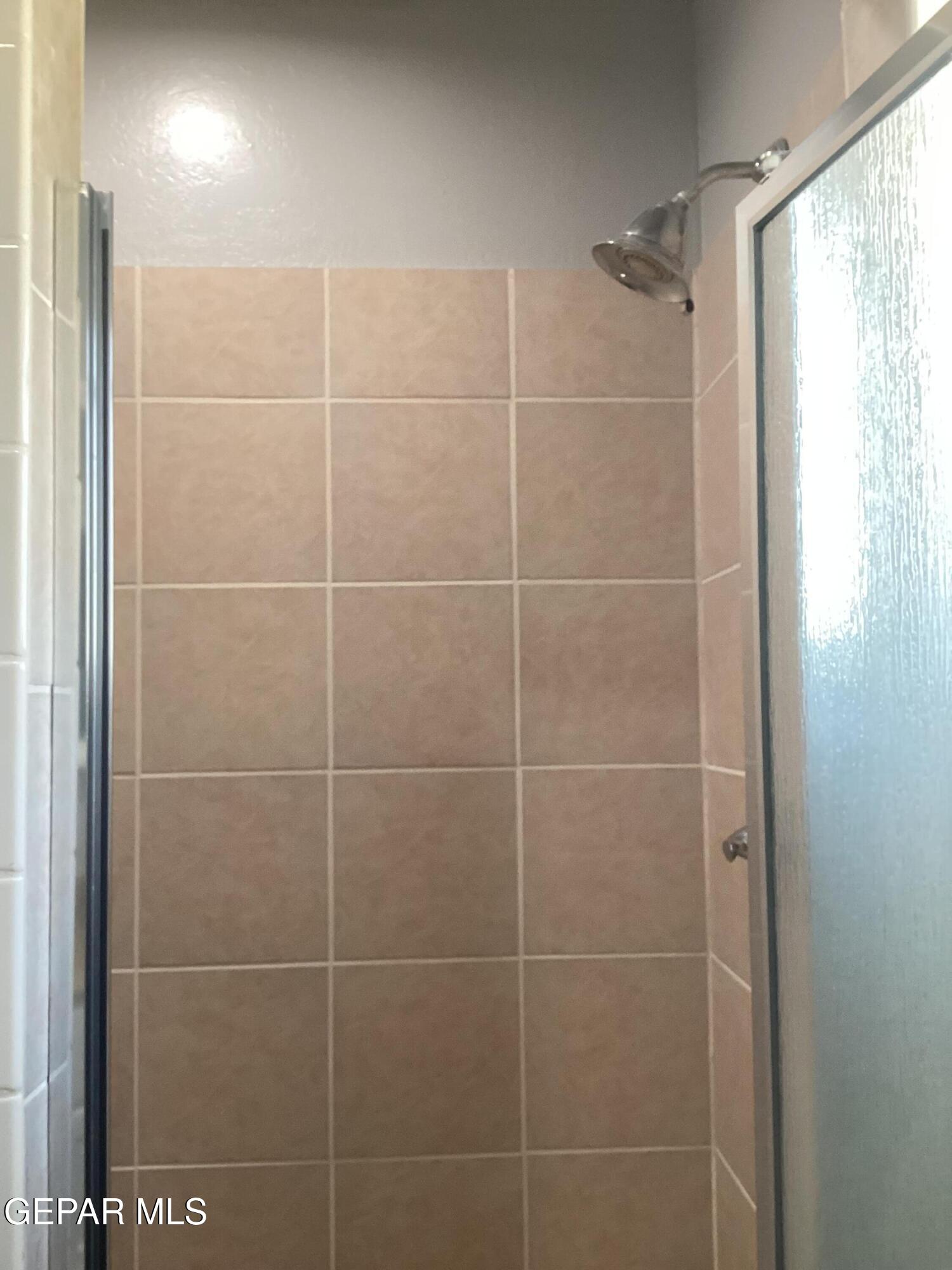 8405 Pinon Street El Paso, TX 79907 - Photo 13 of 21 a bathroom with a shower