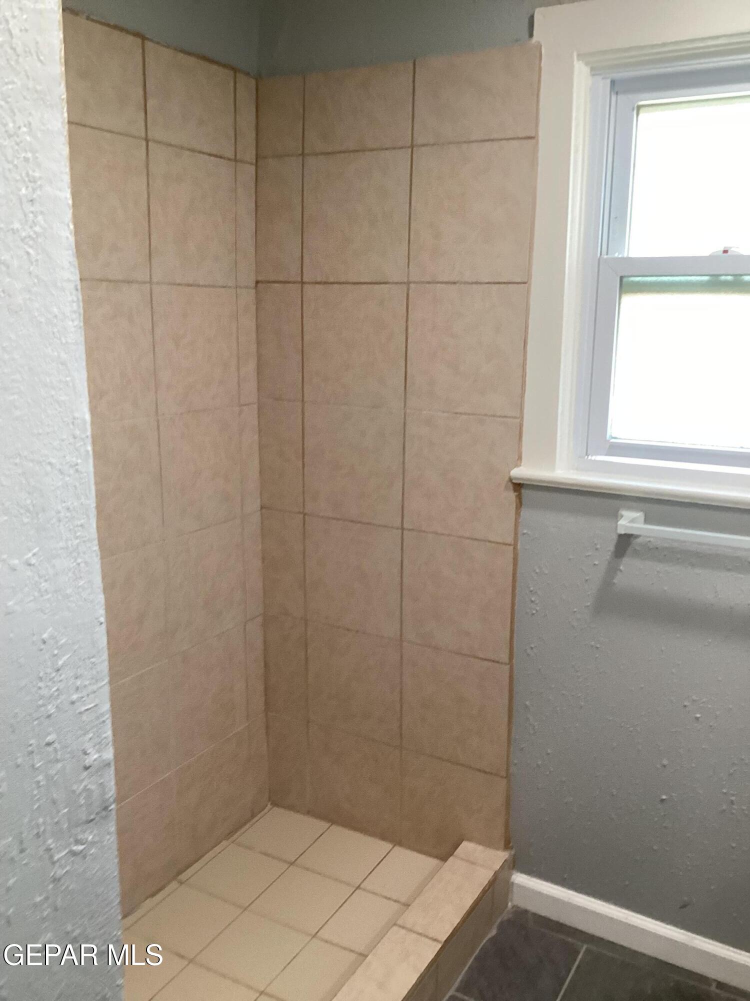 8405 Pinon Street El Paso, TX 79907 - Photo 14 of 21 a bathroom with a shower