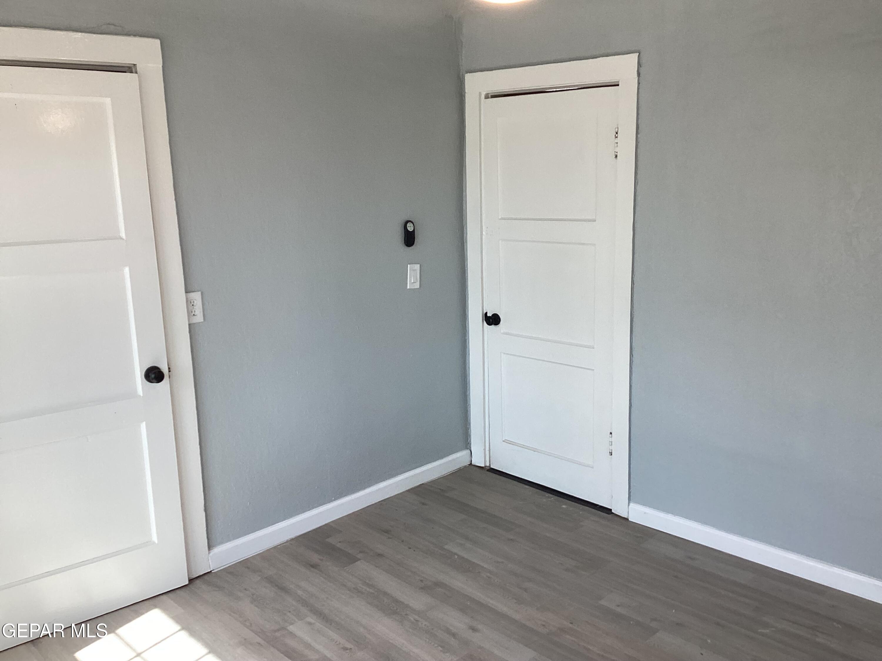 8405 Pinon Street El Paso, TX 79907 - Photo 9 of 21 an empty room with wooden floor