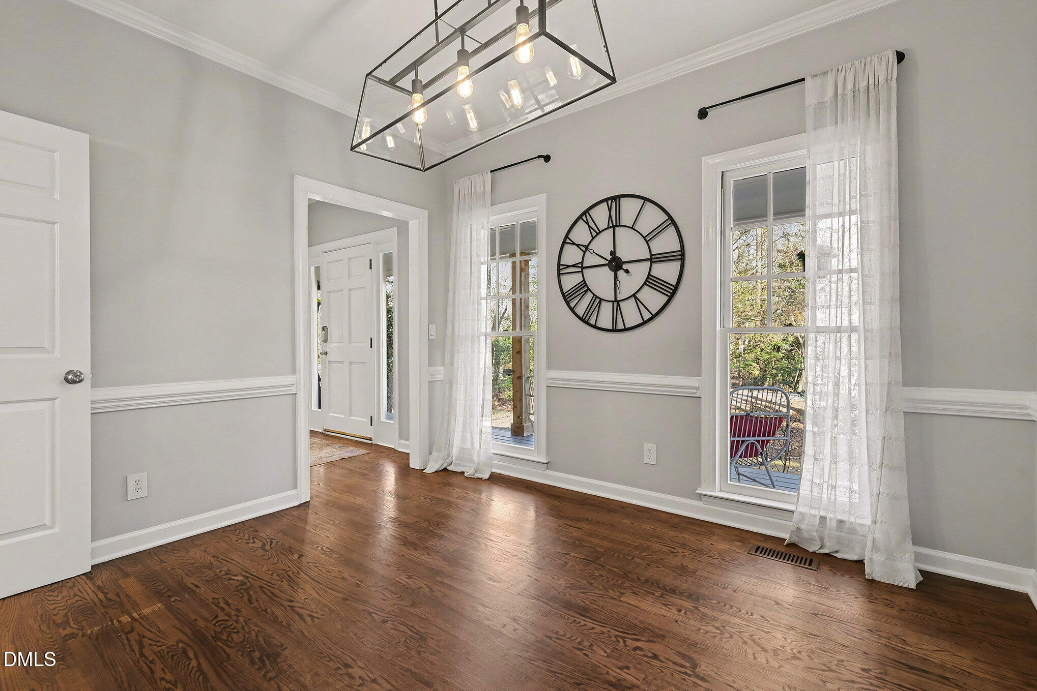 4121 Summer Ridge Court Apex, NC 27539 - Photo 14 of 29 a view of a hallway with wooden floor