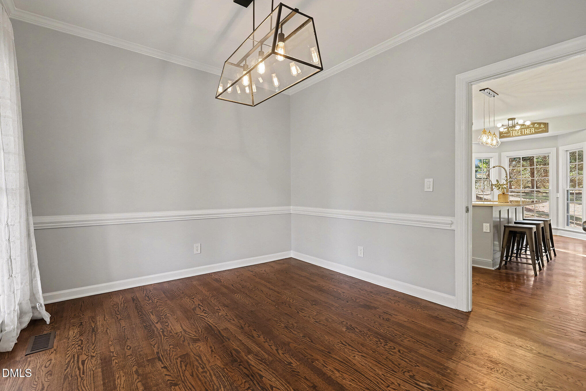 4121 Summer Ridge Court Apex, NC 27539 - Photo 15 of 29 wooden floor in an empty room with a window