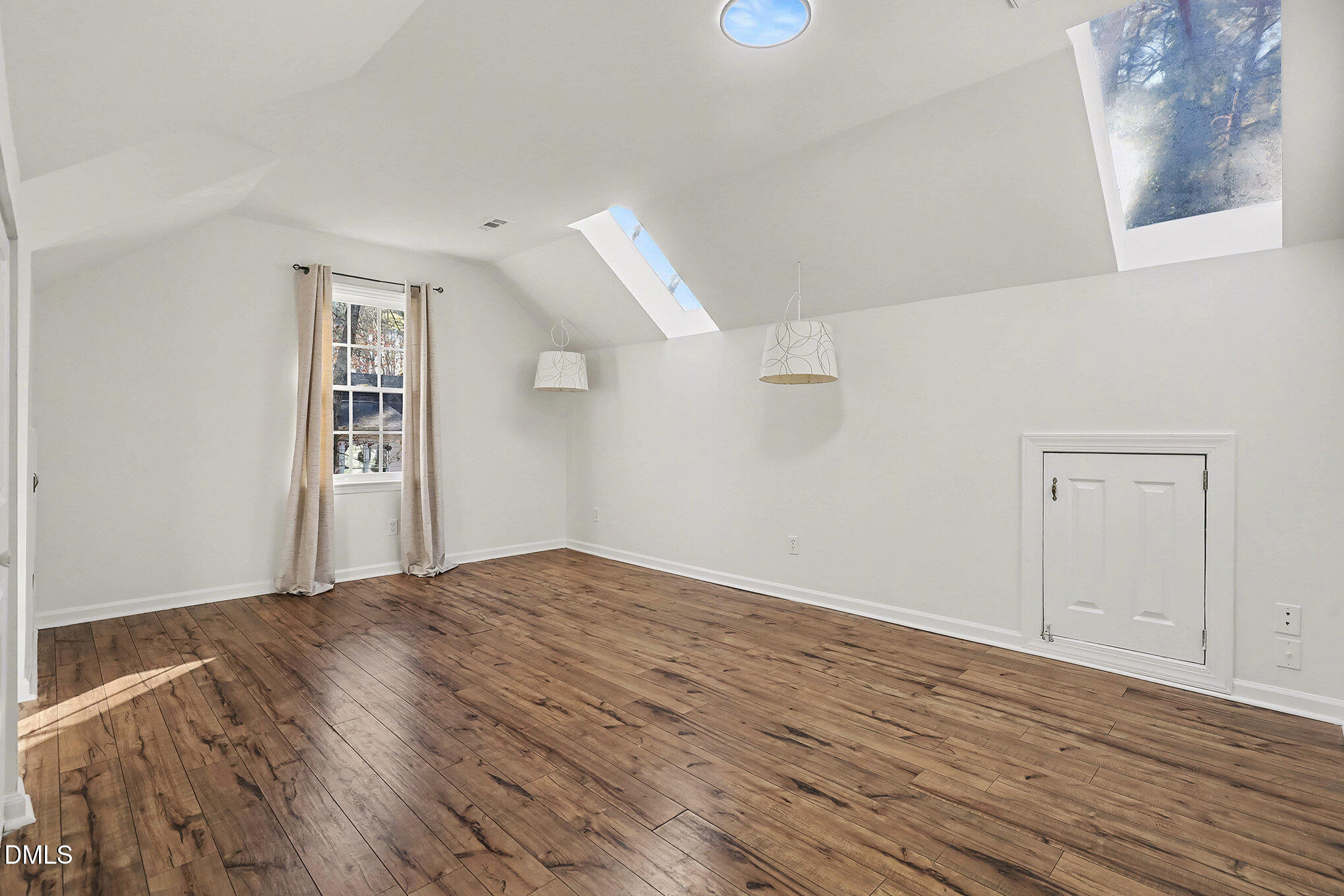 4121 Summer Ridge Court Apex, NC 27539 - Photo 17 of 29 a view of empty room with wooden floor and fan