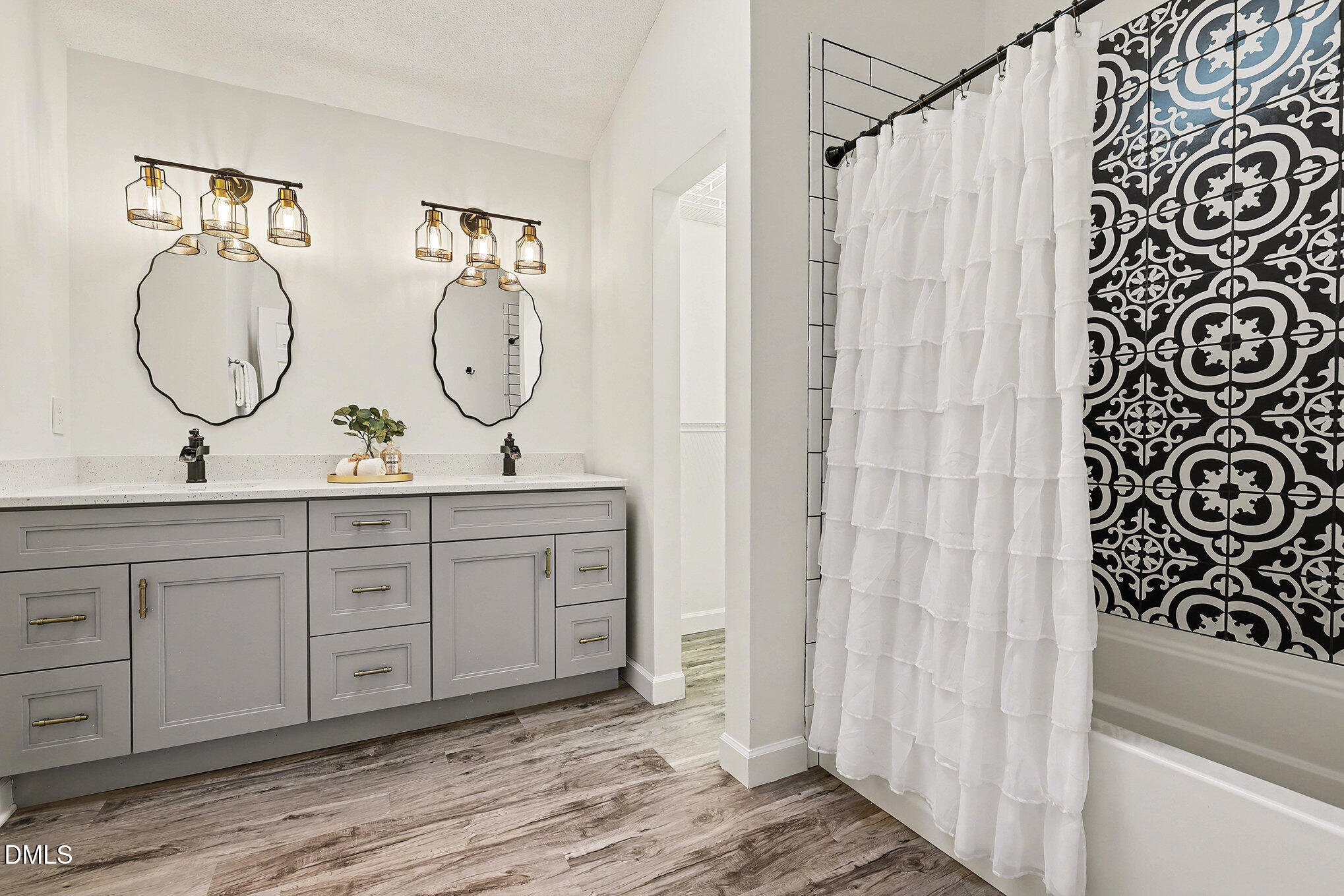 4121 Summer Ridge Court Apex, NC 27539 - Photo 20 of 29 a en suite bathroom with a double vanity sink and a mirror