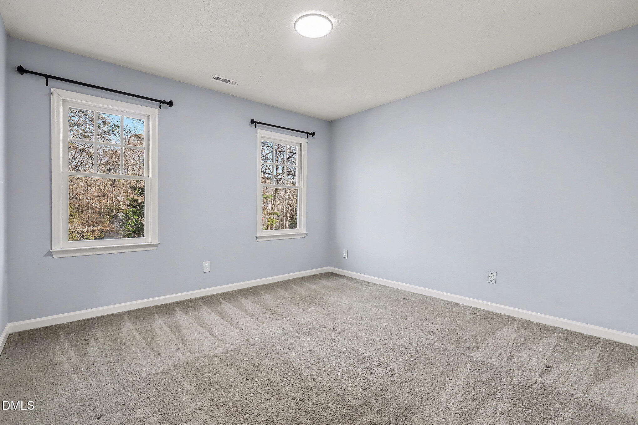 4121 Summer Ridge Court Apex, NC 27539 - Photo 25 of 29 an empty room with windows
