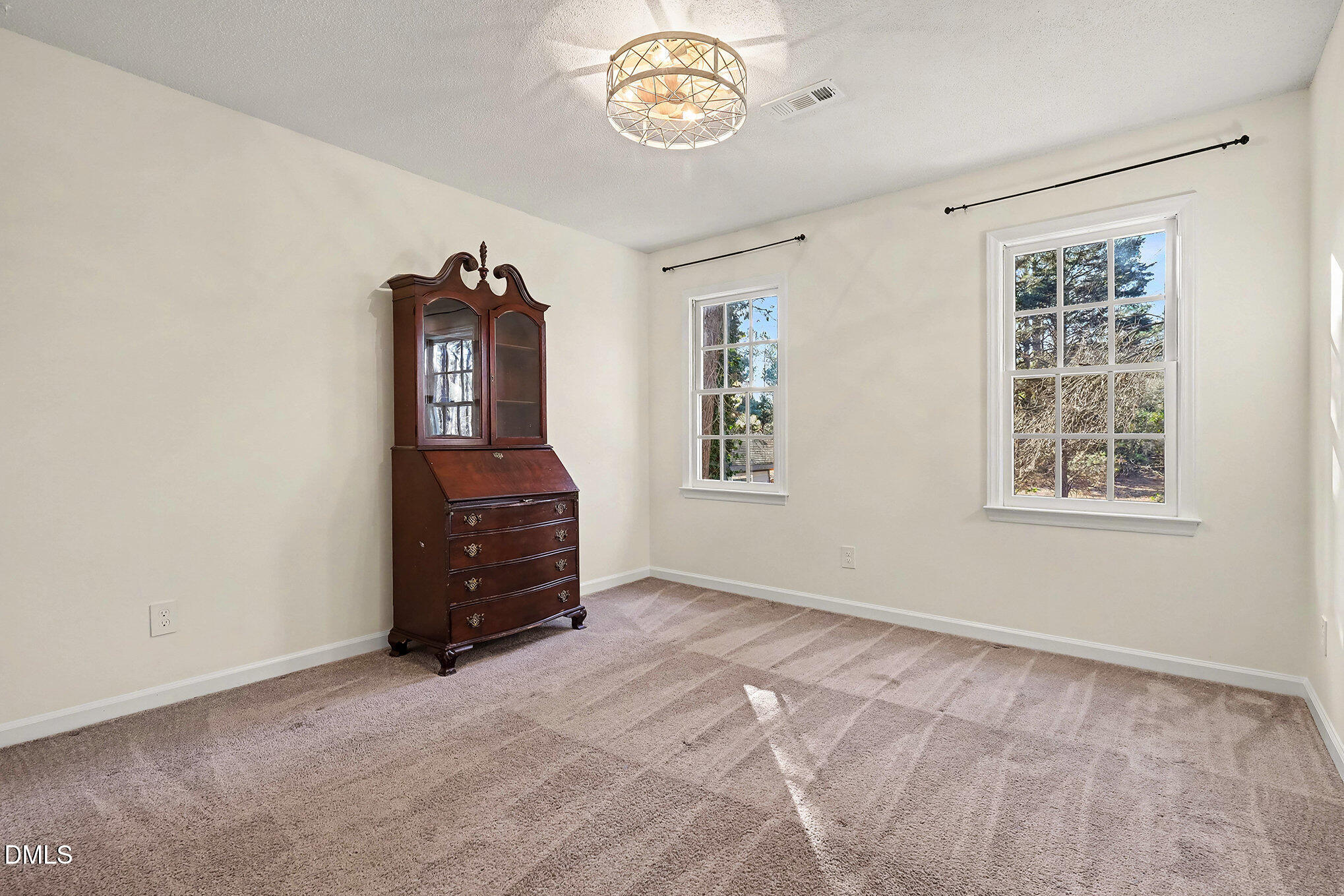 4121 Summer Ridge Court Apex, NC 27539 - Photo 26 of 29 an empty room with windows and closet