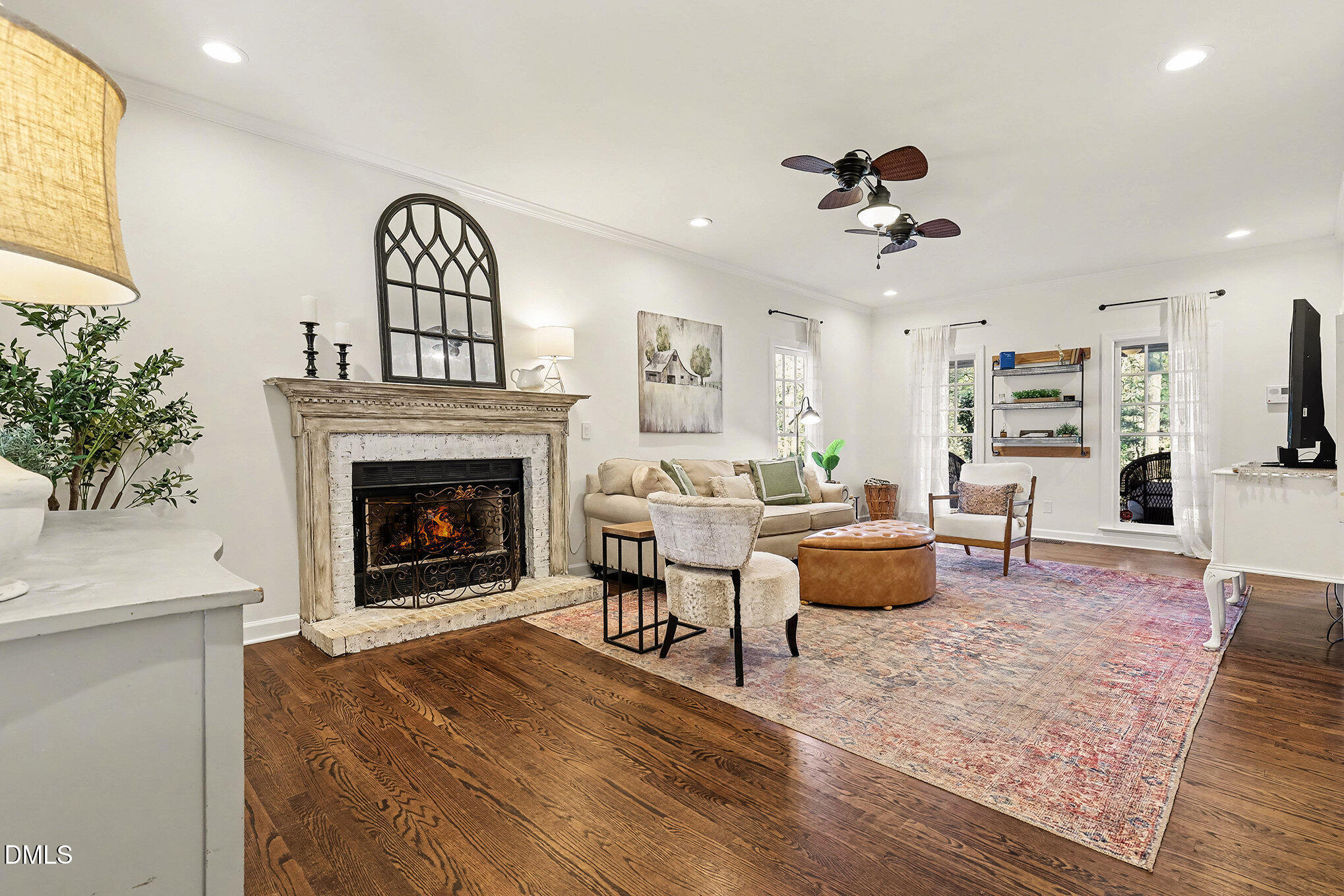 4121 Summer Ridge Court Apex, NC 27539 - Photo 5 of 29 a living room with furniture and a fireplace